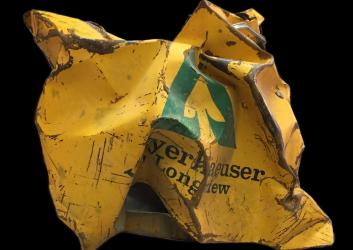A crumpled door of an old Weyerhauser work truck that was mangled in the  1980 eruption of Mount St. Helens.