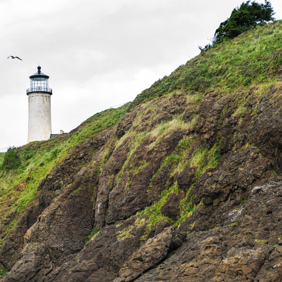 The North Head Lighthouse peaking out behind the hillside. 