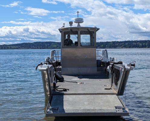 A boat with a ramp to board and disembark