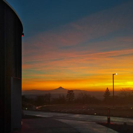 Mountain silhouette with golden hue sunset from the Goldendale parking lot.