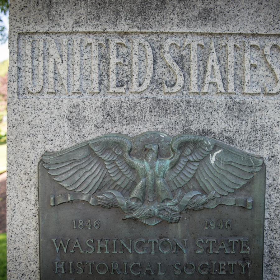 Stone sign that says United States on it