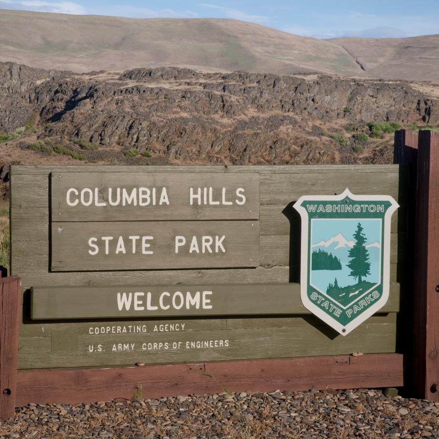 Washington State Parks sign with emblem announcing Columbia Hills entrance