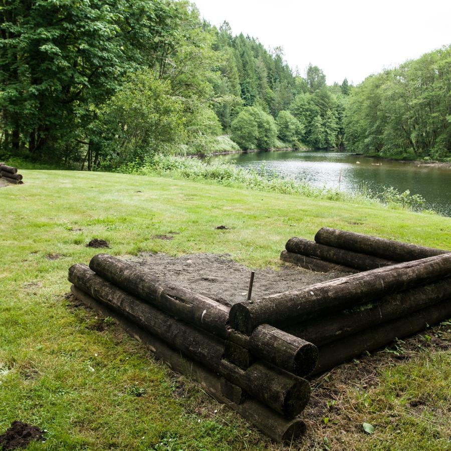 green grassy area with horseshoe pits waiting for visitors