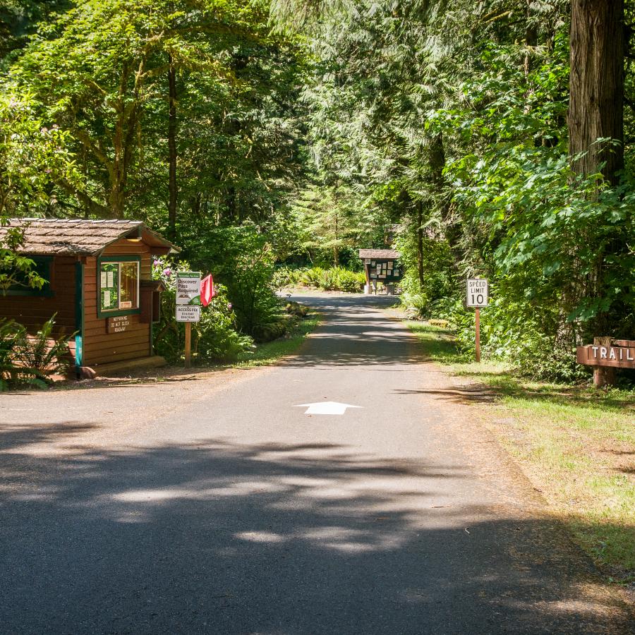 Entrance to Lewis & Clark State Park with Ranger Station on left and Deer Trail sign on right