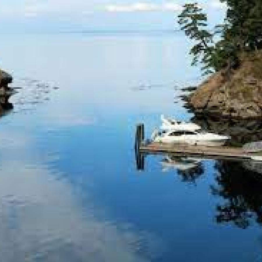 Inlet cove with blue water and boat parked at dock