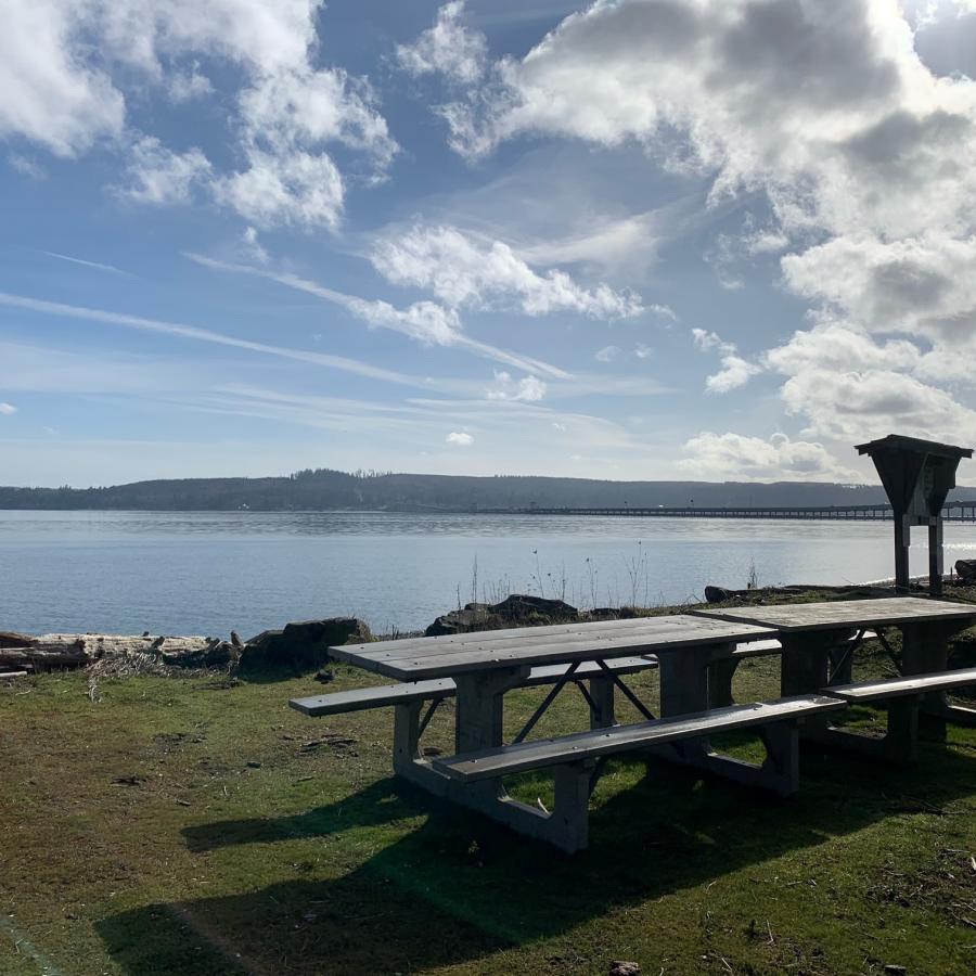 Shine Tidelands picnic area near information sign view of Puget Sound