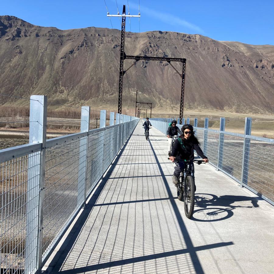 People riding bikes along the Palouse to Cascades State Park Trail.