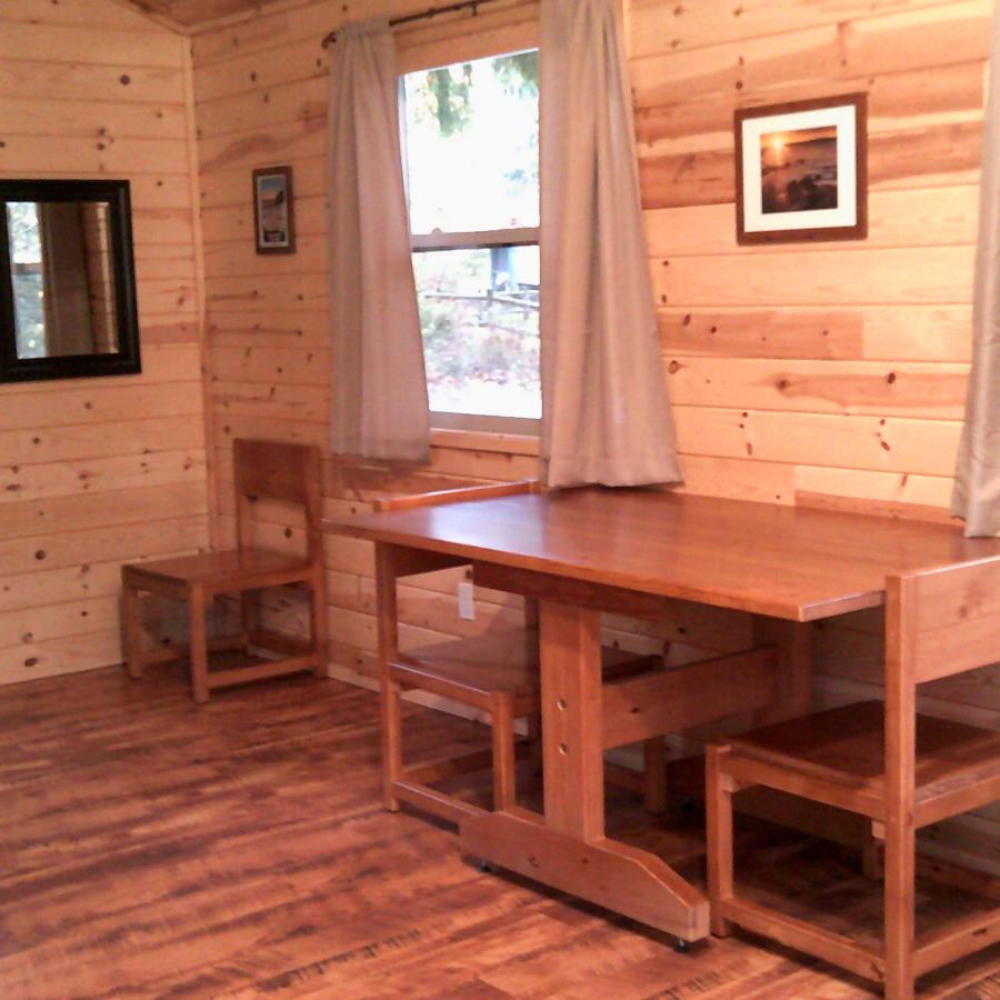 Inside cabins, table with chairs and windows