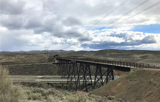 Sage brush covered hills with bridge crossing highway